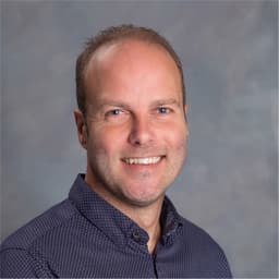 Ben Subercaseaux, smiling, in a navy shirt
