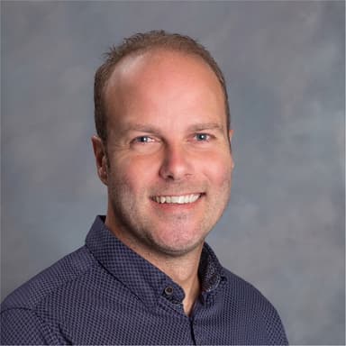 Ben Subercaseaux, smiling, in a navy shirt